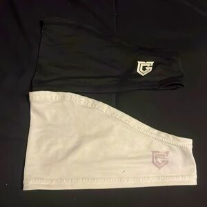 Two skull caps, one white and one black.